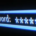 Close-up of a glowing blue screen showing a password prompt filled with asterisks
